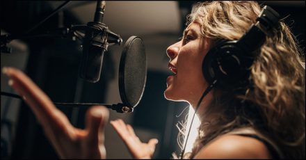 woman singing in the studio