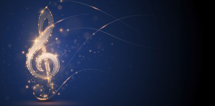 A sparking treble clef on a dark blue background.