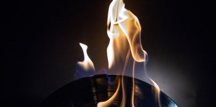 "5 Steps To a Successful CD and Vinyl Album Release" with a A Vinyl record on fire in the background