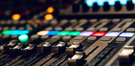 "How Many LUFS Should My Master Be?" - A sound mixing console up close